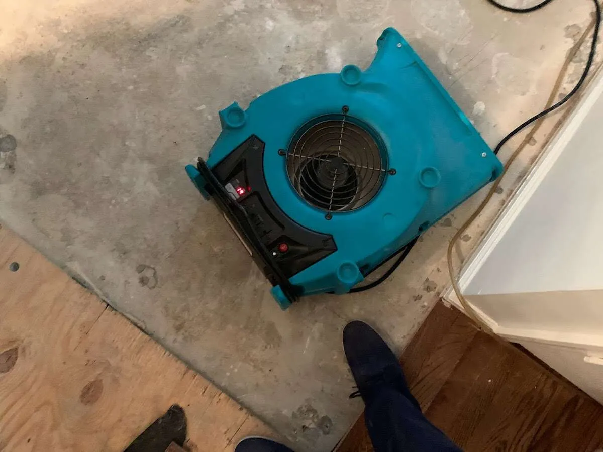 Air mover drying subfloor during Leak Detection & Repair in Escalon
